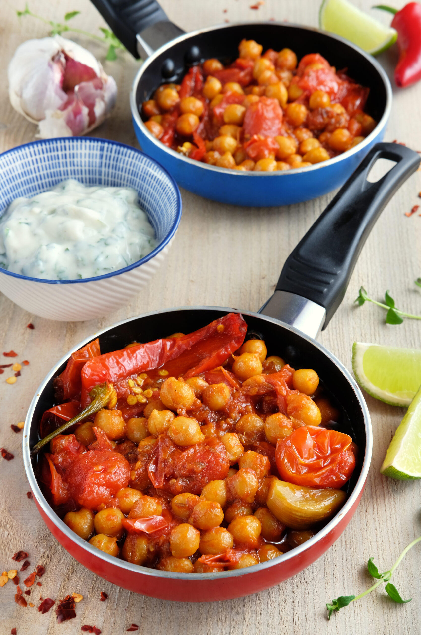 Pans of spiced chickpeas with yoghurt dip