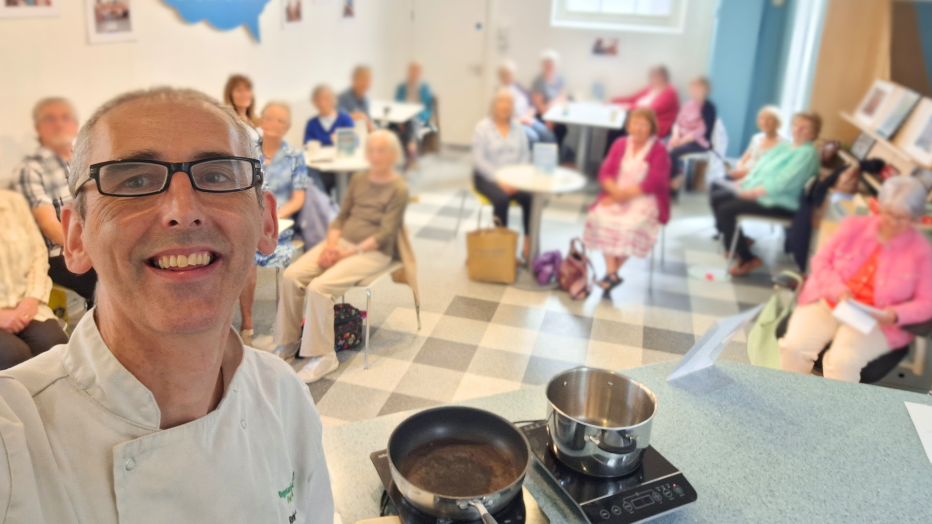 Chef Alex taking a selfie at a cookery demonstration with care home residents